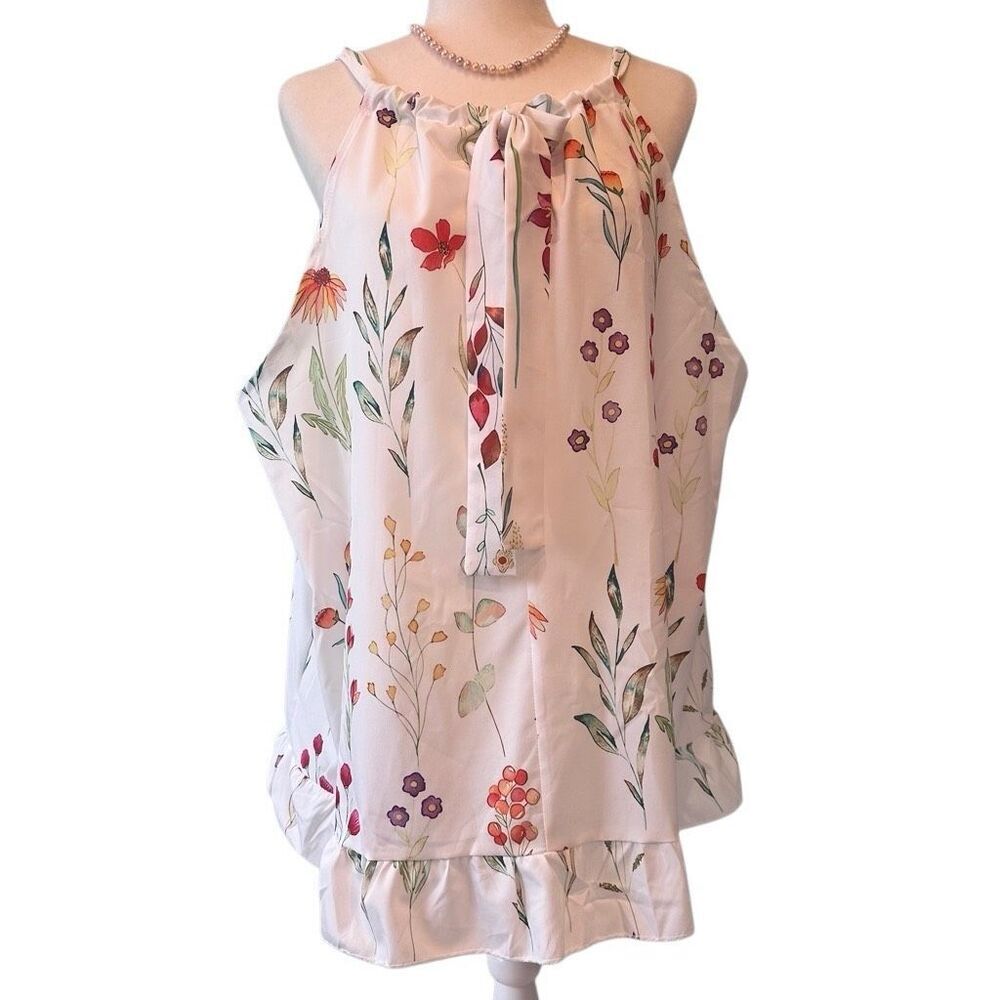 White floral print sleeveless dress with ruffle hem, tie back and keyhole neckli